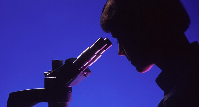 woman scientist microscope research lab test-pubdomain National Cancer Institute