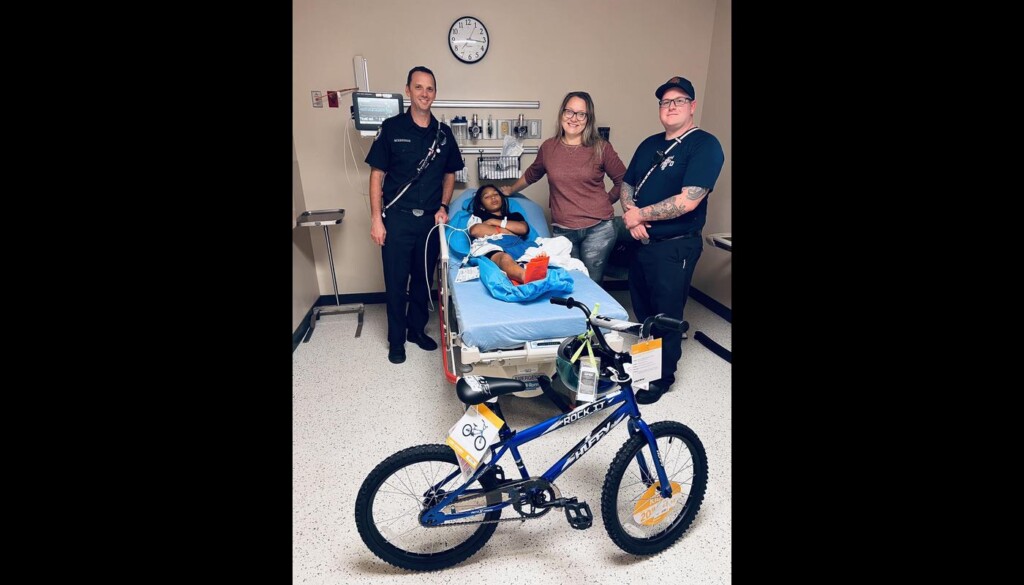 Firefighters Wonder Boy with Emblem New Bicycle After Chopping Spokes to Unfastened His Foot