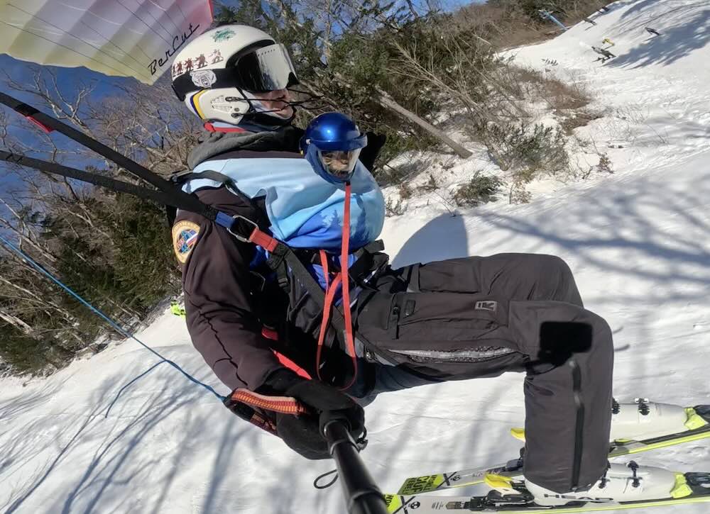 Ivan Kuznetsov parachute skiing with fearless feline wearing tiny helmet SWNS